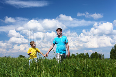 father with son in summer day outdoors