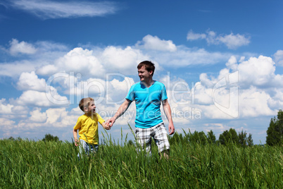 father with son in summer day outdoors