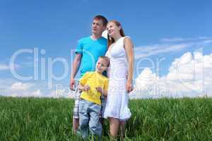 family with son on the meadow