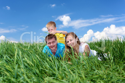 family with son on the meadow