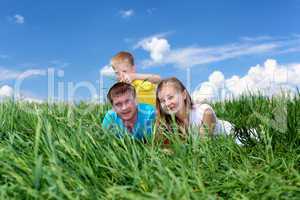 family with son on the meadow