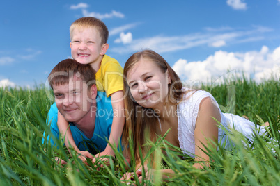 family with son on the meadow