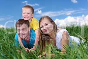 family with son on the meadow