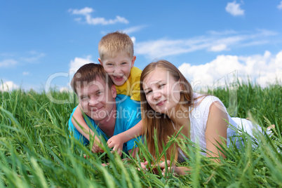 family with son on the meadow