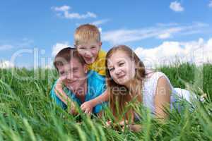 family with son on the meadow