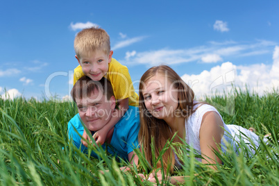 family with son on the meadow