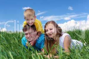 family with son on the meadow