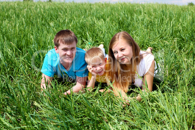 family with son on the meadow