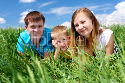 family with son on the meadow