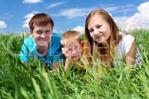 family with son on the meadow