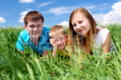 family with son on the meadow family with son on the meadow