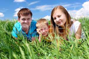 family with son on the meadow