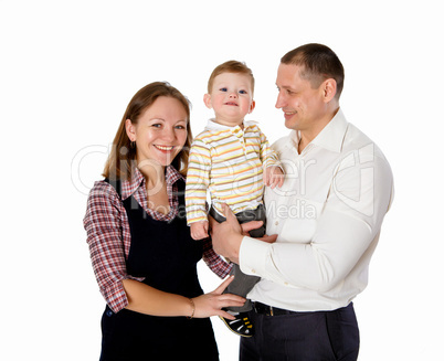 mother, father and their child together in studio