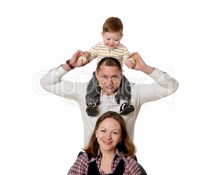 mother, father and their child together in studio