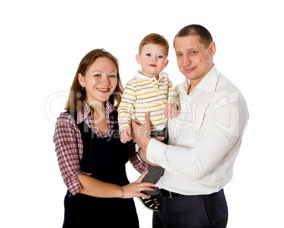 mother, father and their child together in studio