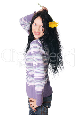 Young lovely brunette playing with a yellow flower isolated on white