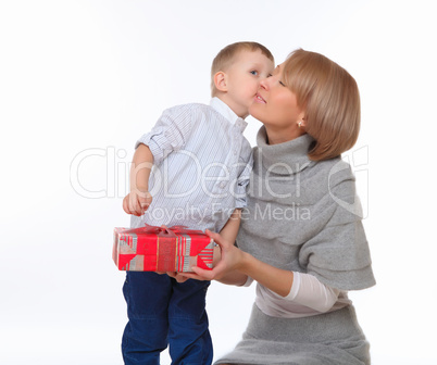 mother and son holding a present