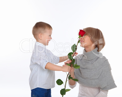 mother and son holding a red rose