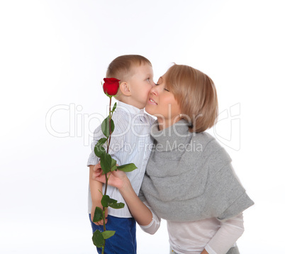 mother and son holding a red rose