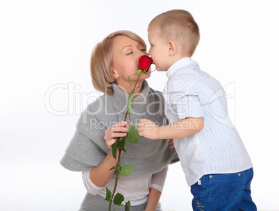 mother and son holding a red rose