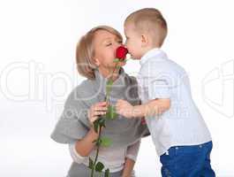 mother and son holding a red rose