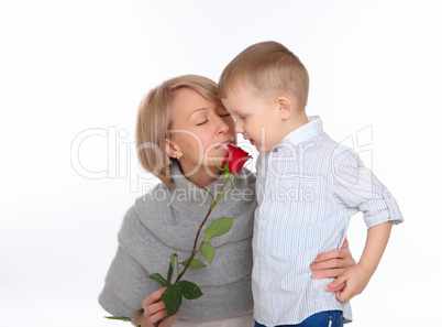 mother and son holding a red rose