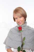 a young pretty woman with a red rose