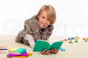 mother at home reading a book alone