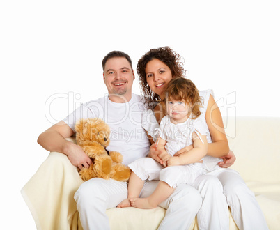 mother, father and their child together in studio