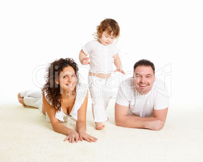 mother, father and their child together in studio