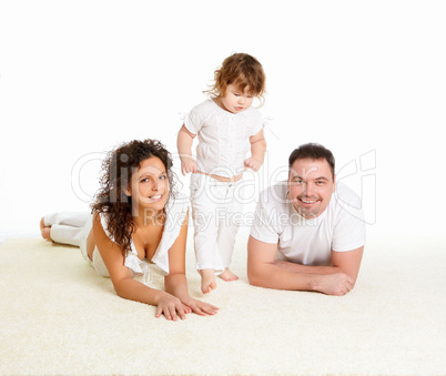 mother, father and their child together in studio