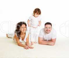 mother, father and their child together in studio