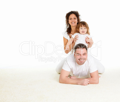 mother, father and their child together in studio
