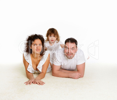 mother, father and their child together in studio