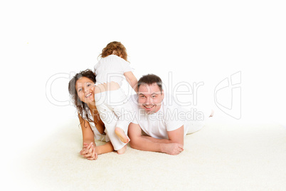 mother, father and their child together in studio