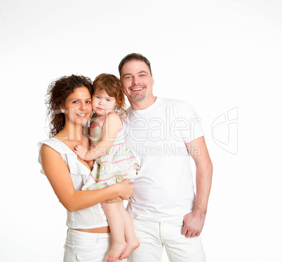 mother, father and their child together in studio