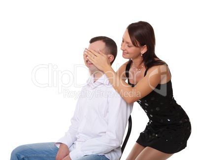 girlfriend closing eyes of her boyfriend
