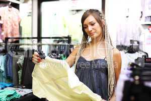 Young girl buying clothes