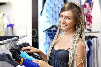 Young girl buying clothes