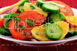 Close-up view of mixed fruits and vegetables salad.