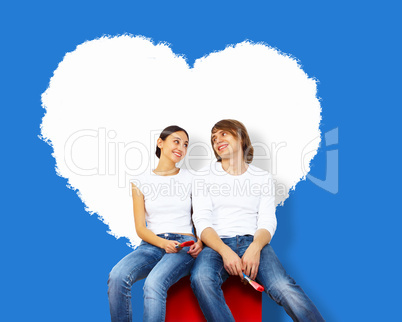 Young couple with paint brushes together