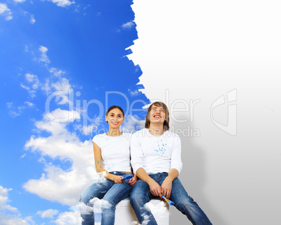 Young couple with paint brushes together