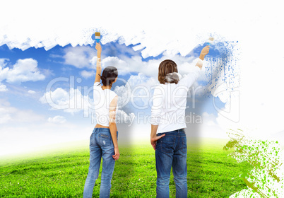 Young couple with paint brushes together