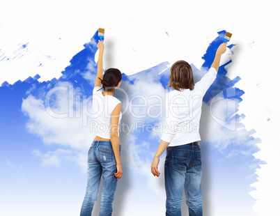 Young couple with paint brushes together