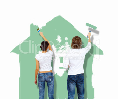 Young couple with paint brushes together