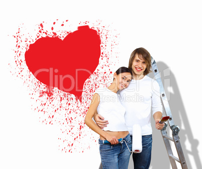 Young couple with paint brushes together