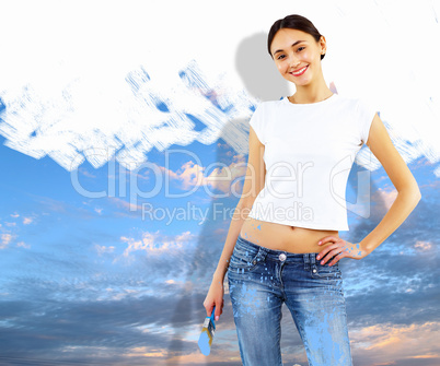 Young woman with paint brush and natural landscape