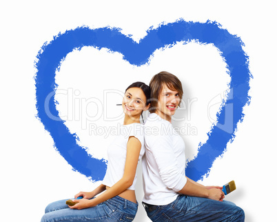 Young couple with paint brushes together
