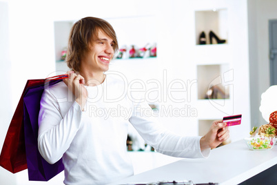 Young man doing shopping