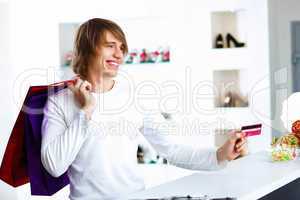 Young man doing shopping